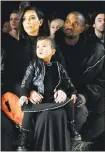  ?? CRAIG BARRITT — GETTY IMAGES ?? Kim Kardashian and Kanye West attend the Alexander Wang Fashion Show in 2015 with daughter North West.