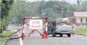  ??  ?? WARNING: sign warns Beware of wild elephants’ at the entrance of Ban Ang Suea Dam village.