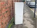  ?? ?? A fridge dumped in a street