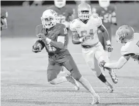  ?? Craig Moseley ?? Houston Baptist quarterbac­k Tony Dawson (11) set up a field goal with this run during the second quarter of Saturday’s game against Sam Houston State.