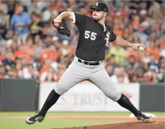  ?? ERIC CHRISTIAN SMITH/ AP ?? Sox starter Carlos Rodon turned in a solid six innings against the Astros on Thursday night, allowing five hits and two runs, but the Sox fell apart at the end.