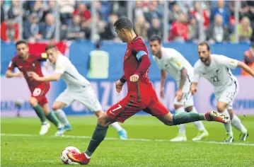  ?? REUTERS ?? Portugal’s Cristiano Ronaldo scores their first goal from the penalty spot.