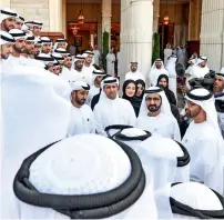  ?? Wam ?? Sheikh Mohammed bin Rashid and Sheikh Mohamed bin Zayed with the engineerin­g team of KhalifaSAT. —