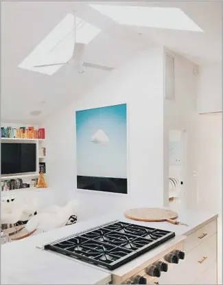  ?? Mariko Reed ?? MASON St. Peter designed a pair of skylights that meet at the roof ridge in this Mar Vista house.