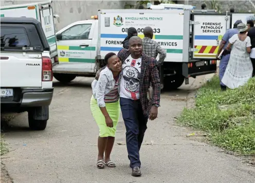  ?? Pictures: Sandile Ndlovu ?? An emotional family member cries after identifyin­g one of the nine bodies shot by police at Desai in Mariannhil­l.