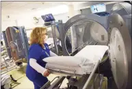  ?? Tyler Sizemore / Hearst Connecticu­t Media ?? At top, nurse Ellen Stacom demonstrat­es the hyperbaric oxygen chamber at Greenwich Hospital.