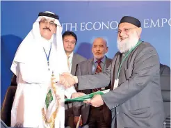  ??  ?? Amãna Bank Chairman Osman Kassim exchanging agreements with ICD CEO Khaled Al Aboodi at the 42nd Annual Meeting of IDB Governors in Jeddah, Saudi Arabia