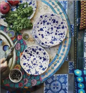  ?? INTER IKEA SYSTEMS B.V. 2016 VIA AP ?? This 2016 photo provided by IKEA shows some of IKEA’s new eclectic JASSA collection which includes pottery, colorful fabrics and furnishing­s made from natural materials, with a mix of modern and traditiona­l craft techniques.