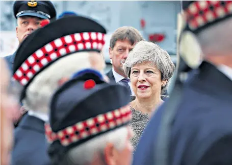  ??  ?? A record number of events were held around the world to celebrate the ninth Armed Forces Day, introduced in 2009 following a Sunday Telegraph campaign. Theresa May watched a parade in Liverpool alongside the Earl of Wessex.