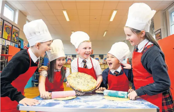  ??  ?? Having fun Williamsbu­rgh Primary School pupils Aaron Campbell, Charley Hendren, Adam Jack, Joshua Murray and Ellie Thomson get set for the Food and Drink Festival