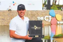  ?? AFP ?? Brooks Koepka with the trophy after winning the CJ Cup golf tournament on Jeju Island, South Korea, yesterday.