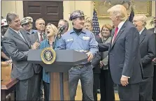  ?? YORK TIMES FILE PHOTO] [NEW ?? President Donald Trump met with coal miners in the Roosevelt Room of the White House on Feb. 16 to witness his signing of a measure to dismantle the Stream Protection Rule, a regulation he deemed as burdensome to the coal industry.