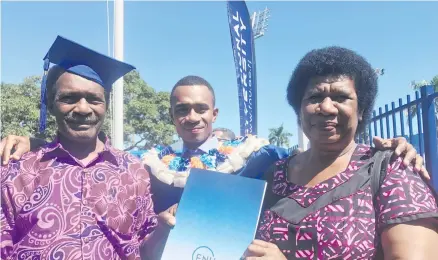  ?? Photo: Selita Bolanavanu­a ?? Isireli Vakamino flanked by his parents Etuate Vakamino and Vasiti Vakamino after his graduation at the FMF Gymnasium in Suva on May 4, 2018.