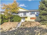  ?? VIVIEN MA. ?? This five-bedroom home in southeast Vancouver offers Fraser River and Richmond views from its gently-sloping lot.