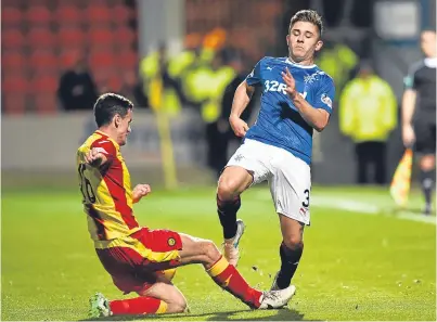  ?? Picture: SNS. ?? Paul McGinn tackles Rangers’ Declan John. The on-loan Cardiff defender is carrying a knock and is not certain to start tonight’s Betfred Cup quarter-final clash against the Jags.