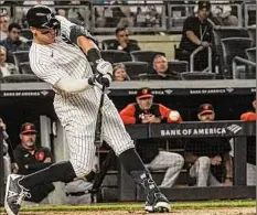  ?? Bebeto Matthews / Associated Press ?? Aaron Judge of the Yankees hits a home run during the fifth inning against Baltimore. He had two home runs in the game.
