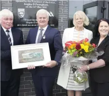  ??  ?? President of the GAA, Aogán Ó’Fearghaíl with his wife Frances at the recent official opening of the Sligo GAA Centre of Excellence in Scarden. Presenting the couple with gifts to mark the occasion are Joe Taafee, Sligo GAA Chairman and Bernardine...