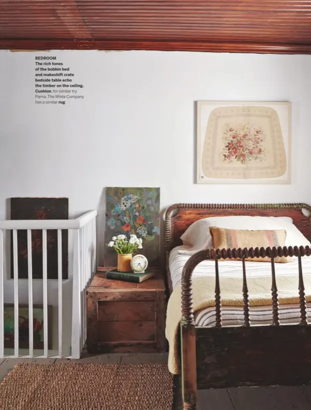  ??  ?? BEDROOM
The rich tones of the bobbin bed and makeshift crate bedside table echo the timber on the ceiling. Cushion, for similar try Parna. The White Company has a similar rug