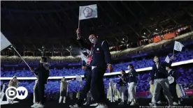  ??  ?? Athletes from Taiwan arrive at the opening ceremony in Tokyo waving the flag of 'Chinese Taipei'