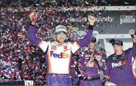  ?? John Raoux Associated Press ?? DENNY HAMLIN enjoys a second victory in a row and third in the last five years at the Daytona 500, held Monday after being postponed Sunday because of rain.