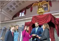  ?? AP PHOTO/JACQUELYN MARTIN ?? Vice President Kamala Harris, right, participat­es in a ceremonial swearing-in of Sen. Katie Britt, R-Ala., center, with Britt’s husband, Wesley Britt, and their children, Bennett Britt and Ridgeway Britt, on Tuesday in Washington.