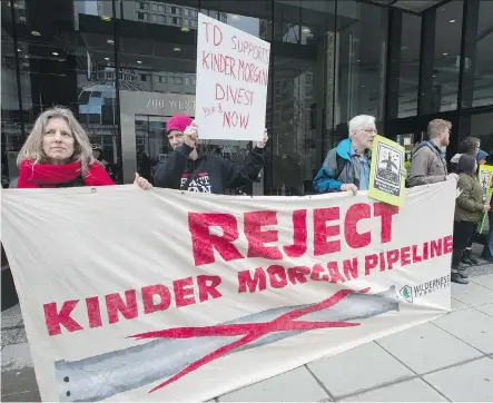  ?? JONATHAN HAYWARD/THE CANADIAN PRESS ?? Shares of Kinder Morgan, a target of anti-pipeline activists, had a rough ride Tuesday as they began trading on the TSX. Investors were deterred by political uncertaint­y in B.C. as well as the company’s plan to use IPO proceeds to pay down its U.S. debt.