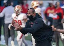  ?? STEPHEN BRASHEAR — THE ASSOCIATED PRESS ?? San Francisco 49ers defensive coordinato­r Robert Saleh cheers on his team from the sideline during the first half of Nov. 1 game against the Seattle Seahawks in Seattle.