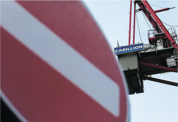  ?? WENN. COM ?? Cranes with the Carillion constructi­on company logo hang over a building site in central London. The company has announced it is to go into liquidatio­n as it has run up large debts and is putting thousands of jobs at risk.