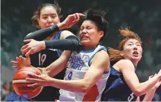  ?? AP ?? A Combined Koreas women’s basketball team in action against Taiwan in the Asian Games semi-final in Indonesia.