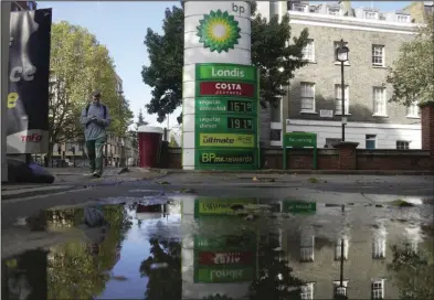  ?? (AP/Kin Cheung) ?? BP’s logo adorns a sign at a gas station in London earlier this month. BP’s earnings more than doubled in the third quarter as the London-based company and other energy giants benefited from high oil and natural gas prices after Russia’s invasion of Ukraine.