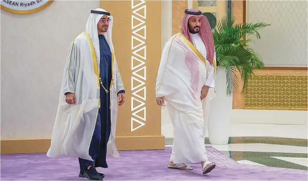  ?? WAM ?? ↑ Sheikh Mohamed Bin Zayed and Prince Mohammed Bin Salman arrive to attend the GCC-ASEAN Summit in Riyadh on Friday.