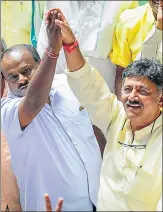  ?? PTI ?? ▪ JD(S) leader HD Kumaraswam­y and Congress leader DK Shivakumar celebrate chief minister BS Yedyurappa’s resignatio­n in Vidhana Soudha, Bengaluru, on Saturday.
