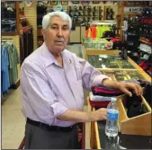  ?? COURTESY PHOTOGRAPH ?? Joe Hassan in his store, Joe Hassan's Clothing and Western Wear.