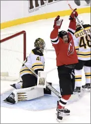  ?? BILL KOSTROUN - THE ASSOCIATED PRESS ?? New Jersey Devils left wing Miles Wood (44) celebrates his goal as Boston Bruins goaltender Jaroslav Halak (41) reacts during the first period of an NHL hockey game Saturday, Jan. 16, 2021, in Newark, N.J.