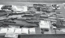  ?? RCMP PIC ?? RCMP seized several weapons and drugs during the raid of a home in North Tryon on Thursday