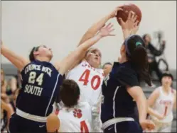  ?? AUSTIN HERTZOG - DIGITAL FIRST MEDIA ?? Owen J. Roberts’ Allie Iyoob (40) battles for a rebound with Council Rock South’s Jenna Culp (24) and Hannah Binder (25).