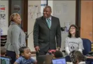  ?? SUBMITTED PHOTO — LORAIN CITY SCHOOLS ?? Lorain Academic Distress Commission Chairman Randall Sampson, center, speaks to Frank Jacinto Elementary Turnaround Principal Paula Baldwin during a visit to Lorain City Schools on March 1.