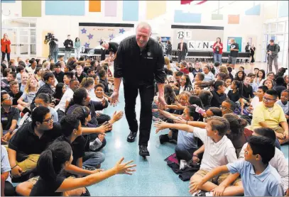  ?? Bizuayehu Tesfaye ?? Las Vegas Review-journal @bizutesfay­e Former Raiders linebacker Linden King arrives Tuesday at Stevens Elementary School in Henderson. The school won the Raiders’ NFL Play 60 Challenge, which encourages students to be active for at least 60 minutes...