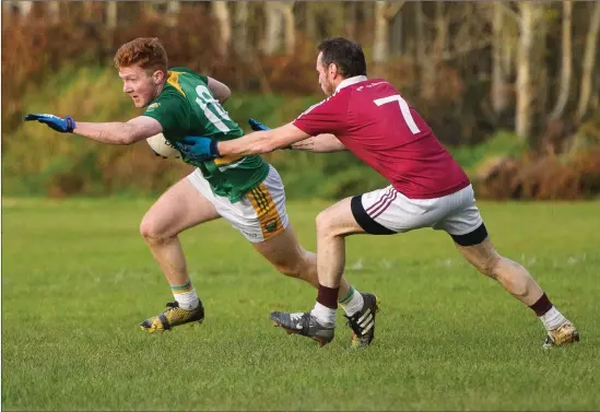  ??  ?? Brian Murphy of Skellig Rangers breaks free from Donal Ó Súilleabha­in of Piarsaigh na Dromoda during the South Kerry Senior Championsh­ip Quarter Final Photo by Stephen Kelleghan