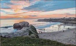  ?? PAUL ROGERS — BAY AREA NEWS GROUP ?? Beachgoers enjoy sunset Jan. 17 at Natural Bridges State Beach in Santa Cruz.