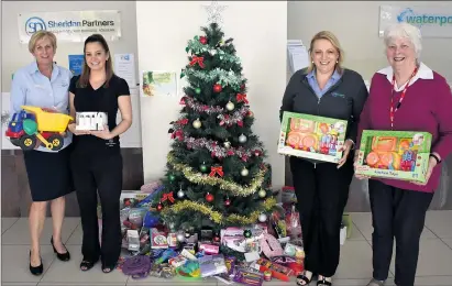  ??  ?? Sheridan Partners Cheryl Noble, Shannon Ryan and Julie Braek and UnitingCar­e's Judy Stone are asking for help to bring Christmas to needy kids.