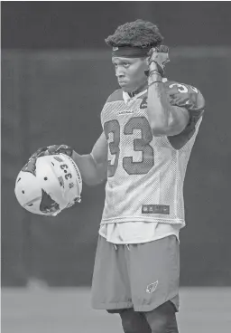  ??  ?? Cardinals defensive back Chris Campbell watches a drill on July 28 during training camp at the University of Phoenix Stadium in Glendale.