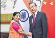  ?? REUTERS ?? External affairs minister Sushma Swaraj with Chinese foreign minister Wang Yi in Beijing on Sunday.