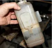  ??  ?? 1
The coolant expansion bottle was so stained that seeing the fluid level was impossible from the outside.