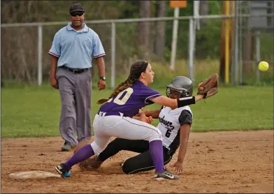  ?? Terrance Armstard/News-Times ?? Safe slide: Smackover's Sharnes McGhee slides safely into second as Junction City's Morgan Butler fields the throw. The Lady Bucks blanked the Lady Dragons 5-0 Tuesday in Smackover.