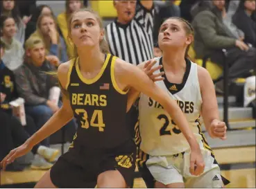  ?? ?? Laney Trausch (right) battles for a rebound after a free throw against Monroe Central.*