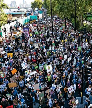  ??  ?? Signs of the times: The central London rally where ‘100,000 took part’