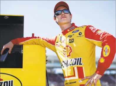  ?? Christian Petersen / Getty Images ?? Joey Logano stands on the grid during qualifying on Saturday for the NASCAR Cup Series FanShield 500 at Phoenix Raceway on in Avondale, Ariz.