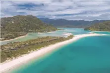  ?? AFP/GETTY IMAGES ?? The Awaroa beach at Awaroa inlet is among nine treks making up the 30th anniversar­y of Great Walks in New Zealand, which has opened its borders to global travellers, tourists and hikers.