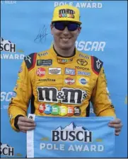  ?? Chuck Burton The Associated Press ?? Kyle Busch, shown Thursday in Concord, N.C., will start from the pole Sunday, chasing his first points-race victory at Charlotte Motor Speedway.